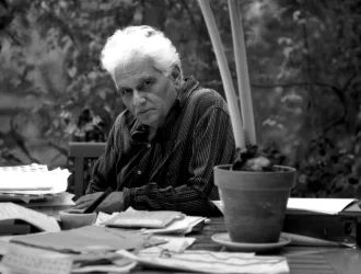 The image shows Derrida, the man who is the champion of 'Deconstruction'.