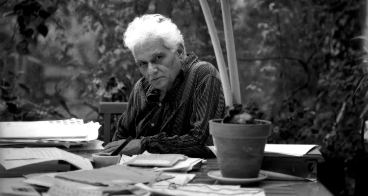 The image shows Derrida, the man who is the champion of 'Deconstruction'.