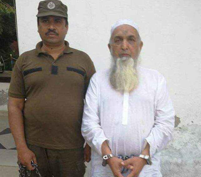 The image shows a cleric being arrested for sexual abuse
